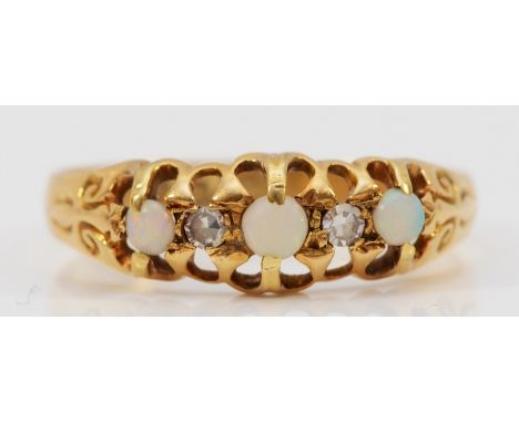 An 18ct gold opal and diamond dress ring, Birmingham 1912, P, 2g