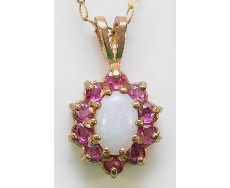A 9ct gold opal and ruby cluster pendant with a chain, 1.2g