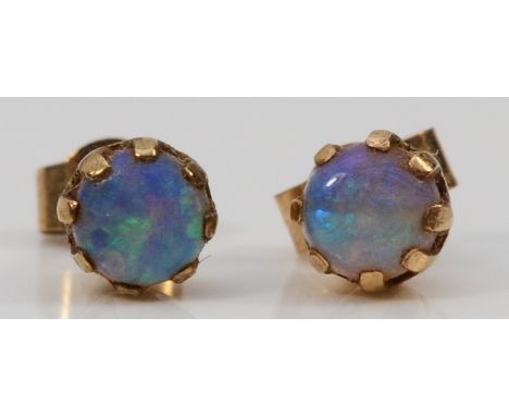 A pair of 9ct gold opal earrings with scroll backs, 4mm diameter, 0.6g