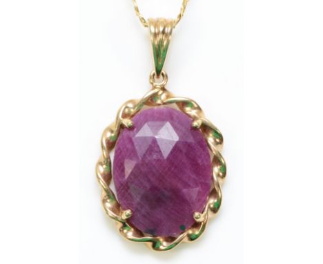 A 9ct gold ruby pendant with a chain, 17mm x 13mm ruby, 4.2g