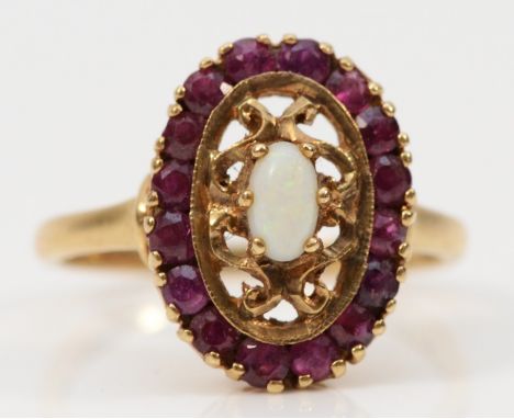 A 9ct gold opal and ruby dress ring, M, 3.2g