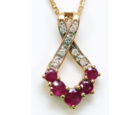 A 9ct gold diamond and ruby pendant with a chain, 20mm length, 1.8g