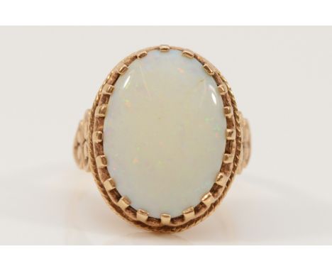A 9ct gold vintage opal dress ring with patterned mount, N, 5.4g