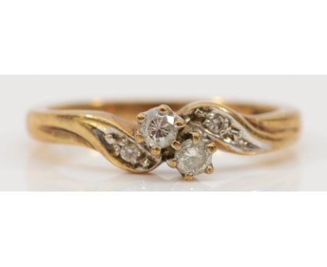 A 9ct gold diamond cross over ring, L, 2.4g