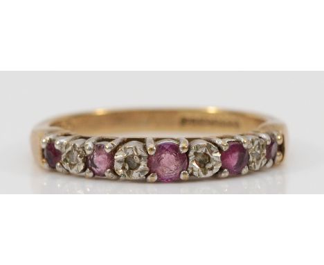 A 9ct gold diamond and ruby half eternity ring, L 1/2, 2g