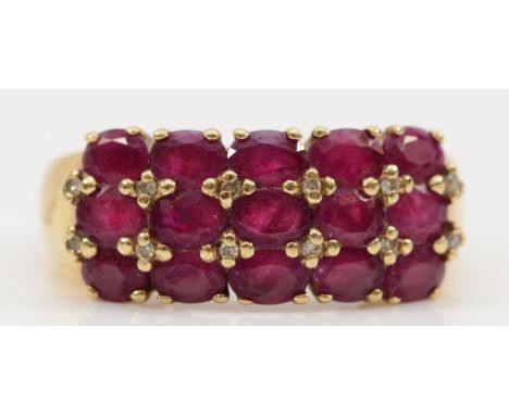 A 9ct gold diamond and ruby three row dress ring, R, 5.3g