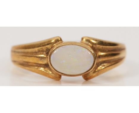 A 9ct gold opal solitaire ring, L 1/2, 2.1g