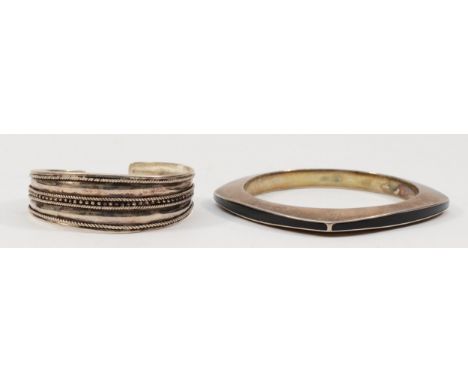 A silver and black enamel bangle, London 2003, 65mm internal, and a 925 silver bangle, 62gm