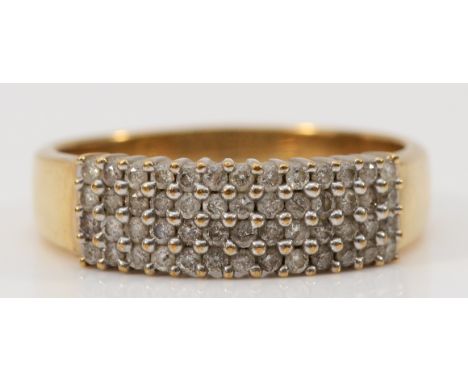 A 9ct gold diamond four row dress ring, stated 0.50ct diamond weight, R 1/2, 3.5g