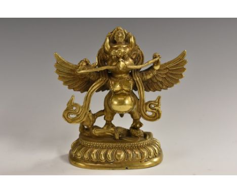 Indian School, a gilt bronze deity, rounded lotus base, 13.5cm high