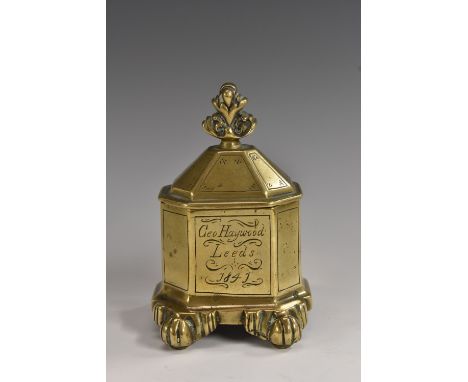 An early Victorian brass canted rectangular tobacco jar, acanthus finial, inscribed Geo. Haywood, Leeds 1841, paw feet, 13.5c