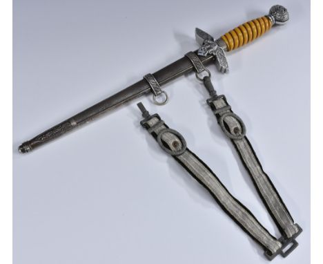 A Nazi German Third Reich Luftwaffe dagger, the 25cm straight, pointed double-edged blade unmarked, wire-bound orange plastic