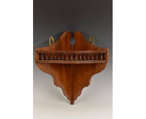 An Edwardian mahogany corner bracket, swan neck cresting above a serpentine tier with balustrade gallery, 34cm high, c.1905