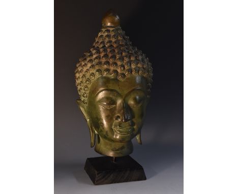 Chinese School, a verdigris patinated bronze sculptural fragment, the head of Buddha, plinth,mount, 31cm high overall