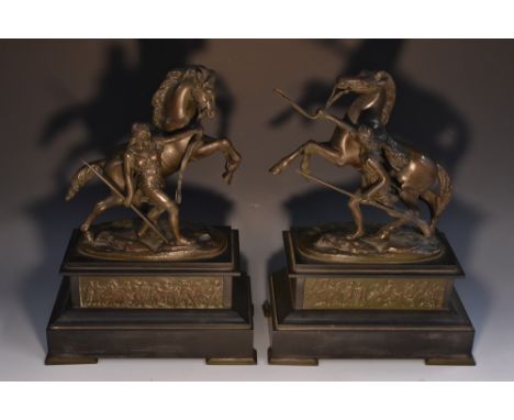 After Guillaume Coustou the Elder, a pair of dark patinated spelter models, The Horses of Marly, each belge noir plinth with 