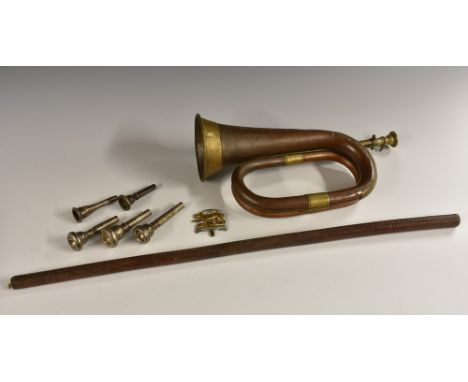 A World War I copper and brass bugle, by George Potter & Co, Aldershot, 33.5cm long; additional mouthpieces; an Officer's lea