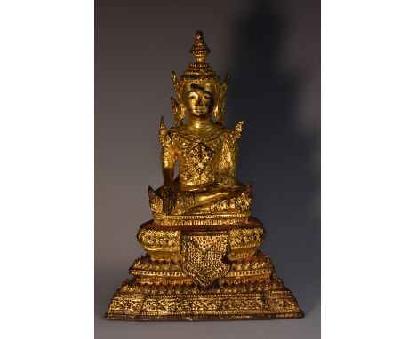 An Indonesian gilt bronze Buddha, seated in meditation, stepped lotus base, 19cm high