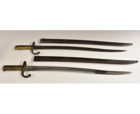 A French chassepot bayonet, 57cm serpentine fullered blade, ribbed brass grip, curved quillon, steel scabbard with correspond