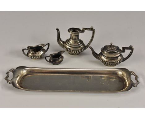 An Elizabeth II silver miniature toy four piece half-fluted tea and coffee service on tray, comprising teapot, coffee pot, mi