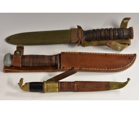 A World War II American M3 fighting knife, 17cm blade marked US M3-Utica, ring grip, 29.5cm long overall, green painted scabb