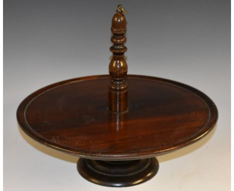 A Victorian circular table-top dumb waiter, turned pillar with brass axe head finial, stepped base, 35cm diam, c.1880