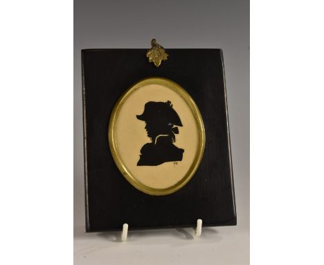 A Hadley's Worcester oval plaque, of a portrait silhouette, painted in black enamel on an ochre ground with a profile of a Br
