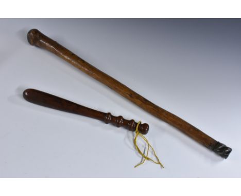 A 19th century shillelagh type club, possibly Irish, wrythen brass pommel, 71cm long; a Victorian rosewood truncheon, ring-tu
