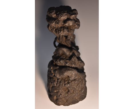 A 19th century Irish bog oak carving, of a fox stalking a rabbit around a tree trunk, 29.5cm high, c.1870