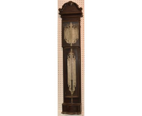 A late 18th century Dutch mercury tube stick barometer, mahogany, the pediment centered by a pellet, silvered fretted weather