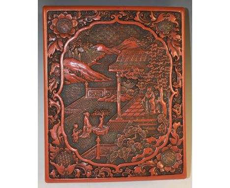 A Chinese cinnabar lacquer domed rectangular box and cover, in relief with figures and a pagoda in a monumental landscape, 25