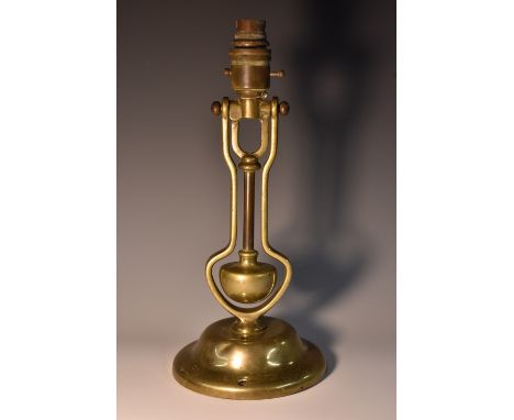 An early 20th century brass gimbal table lamp, probably for use on board a ship, domed base, 31cm high