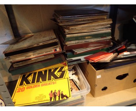 Shelf of mixed genre records and CDs including Kinks Frank Sinatra etc