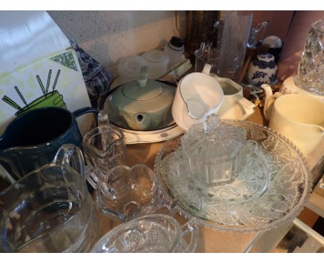 Shelf of mixed ceramics glassware metalware and a new and boxed fondue set