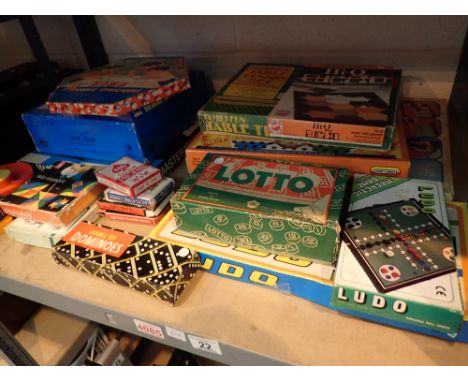 Shelf of mixed board games including Trivial Pursuit Mastermind Table Tennis Saolitaire etc 