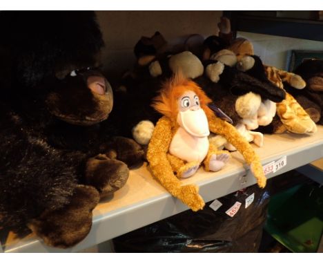 Shelf of plush toys mostly apes and monkeys