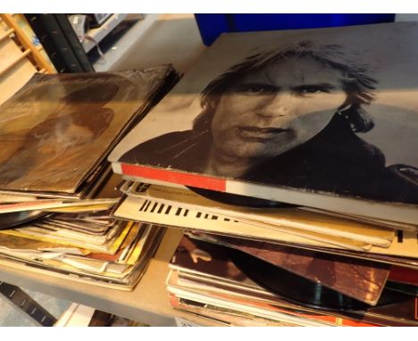 Shelf of mixed genre records