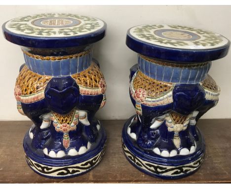 A pair of oriental painted ceramic elephant garden seats 