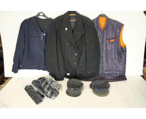 A British Rail driver's slip-over jacket, a nylon quilted British Rail jacket and a British Rail woolen overcoat plus two Bri