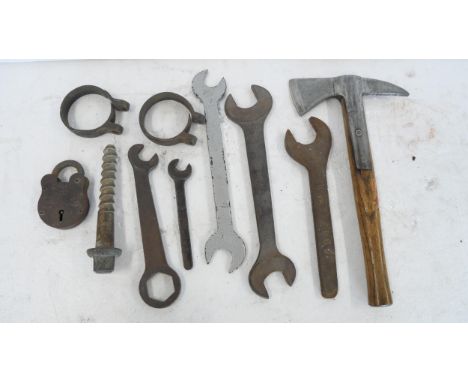 A collection of railway spanners comprising LNER, GWR, LMS and North British examples, a BR(M) Gilpins hand axe a track bolt,