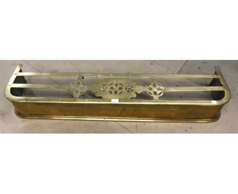 A Victorian brass fender 