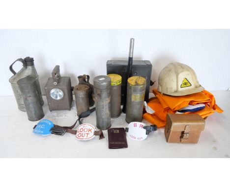 A collection of lineside worker-related items including a Wonder Agral lamp, a BR hard hat, detonator cases and high-vis clot