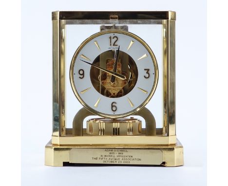 Jaeger LeCoultre Atmos Clock. Housed in brass and glass case. Makers mark inscribed on dial, presentation attached to case. A