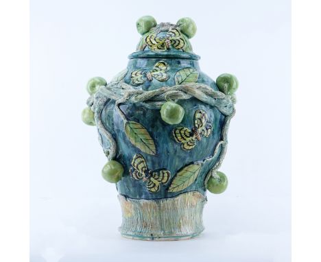 Macario Covarrubia, Mexican (20th C) High relief dome lidded ceramic urn. With applied apples, twisted vine branches and butt