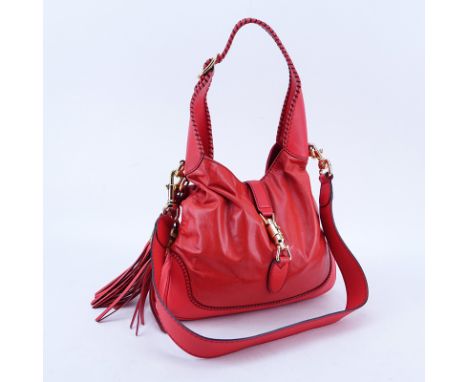 Gucci Orange Leather New Jackie Indy Handbag. Gold tone hardware, black signature fabric interior with zippered and patch poc