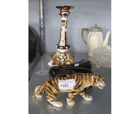 A BLACK POTTERY WALL POCKET, AN IMARI PAINTED PORCELAIN CANDLESTICK AND A POTTERY MODEL OF TIGER 