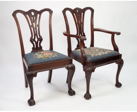 SET OF EIGHT EARLY TWENTIETH CENTURY CARVED MAHOGANY DINING CHAIRS (6+2) IN THE CHIPPENDALE STYLE, each with pierced splat to