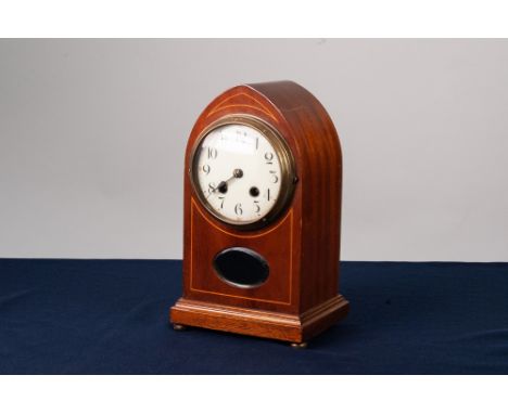 EDWARDIAN LINE INLAID MAHOGANY MANTEL CLOCK IN LANCET TOP CASE, the 4 ½" Arabic dial set above an oval, bevel edged glazed ap