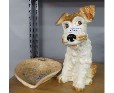 SYLVAC POTTERY MODEL OF A SEATED TERRIER DOG, GIVING A SIDEWAYS GLANCE AND AN ARTHUR WOOD POTTERY LEAF SHAPED AND FLORAL EMBO