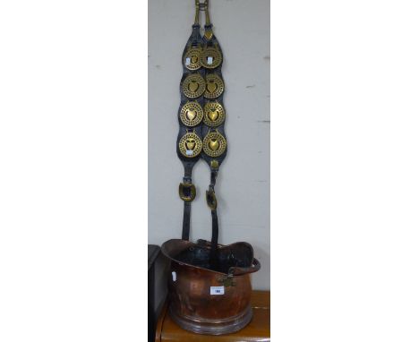 SET OF EIGHT OLD HORSE BRASSES, MOUNTED ON A PAIR OF LEATHER STRAPS AND A COPPER HELMET SHAPED COAL RECEIVER 