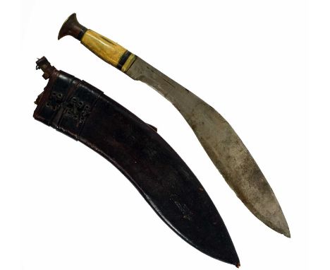 A Kukri, the 35cm curved steel blade with narrow short fuller, stamped RODGERS &amp; SONS, No.6 Sheffield Steel, with brass b